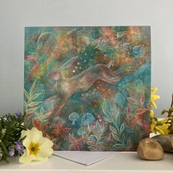 a painted image of a hare in woodland imagery with shades of teal, orange and red surrounding