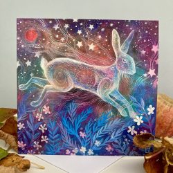 a painted image of a ghostly hare against a star filled sky with a red moon above and blue ferns below